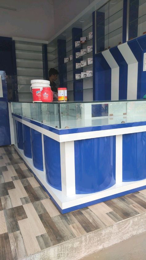 Mobile Shop Counter Design Modern, Kirana Store Design Counter, Counter Design Shop Retail Stores, Mobile Shop Counter Design, Mobile Shop Counter, Tiger Furniture, Tv Cupboard Design, Office Counter Design, Dhoom 2