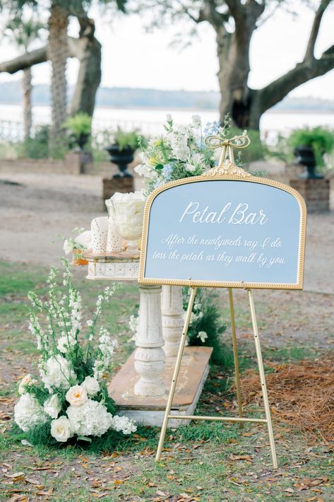 Flower petal bar at wedding ceremony. Flower Petal Holder Wedding, Petal Bar At Weddings, Flower Petal Throw Wedding, Wedding Ceremony Drinks, Wedding Petal Bar, Petals Aisle Wedding, Petal Throw Wedding, Flower Petal Toss Wedding, Umbrella Wedding Ceremony