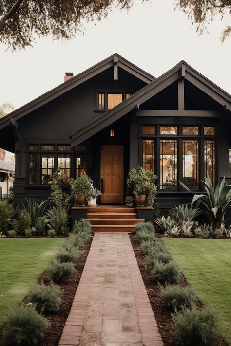 40+ Elegant Black Home Exterior Ideas Black Exterior Garage Doors, Black House Black Roof, Moody Craftsman Exterior, Small Home Exterior Ideas, Small House Exterior Colors, Dark Exterior House Colors, Black Home Exterior, Home Exterior Ideas, Painting Brick