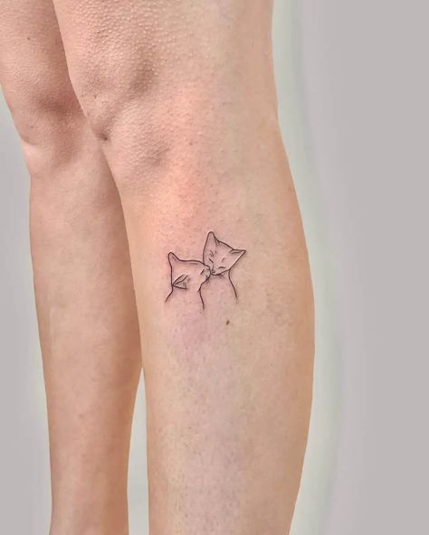 Cat Small Tattoo Ideas, Tasteful Cat Tattoos, Cat Tattoo On Leg, Cat Inspired Tattoos Minimalist, Two Cats Tattoo Ideas, Simple Kitty Tattoo, Two Cats Tattoo Outline, Small Dainty Cat Tattoos, Cat Tattoo 2 Cats