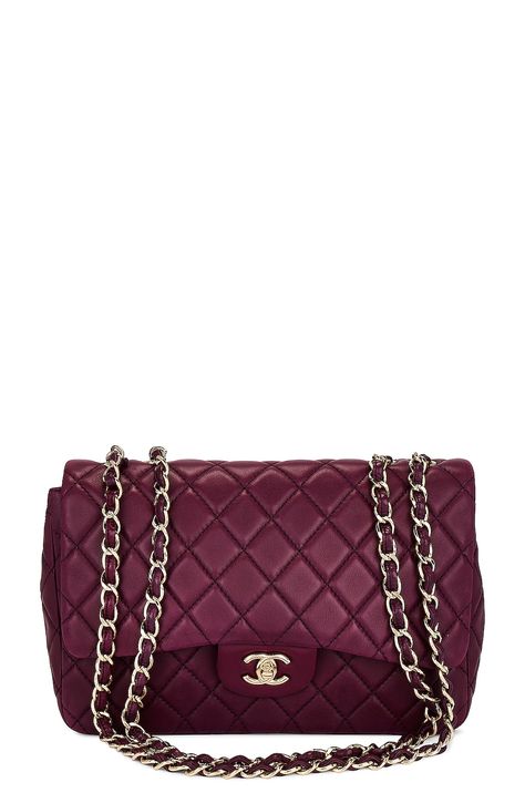 Find CHANEL Jumbo Classic Flap Bag on Editorialist. This Chanel Jumbo Classic Flap Bag features a quilted lambskin leather exterior with leather lining and gold-tone hardware. The bag has a turn lock closure, one main compartment, one interior flat pocket, one interior zip pocket, and one exterior flat pocket. The bag includes a serial card and measures approximately 11.5 inches wide, 8 inches high, and 3.5 inches deep. It has an adjustable shoulder strap with a 14-25 inch drop. The bag is in go Chanel Jumbo Flap, Chanel Jumbo, Classic Flap Bag, Flap Shoulder Bag, Purple Bags, Dream Board, Classic Flap, Flap Bag, Lambskin Leather