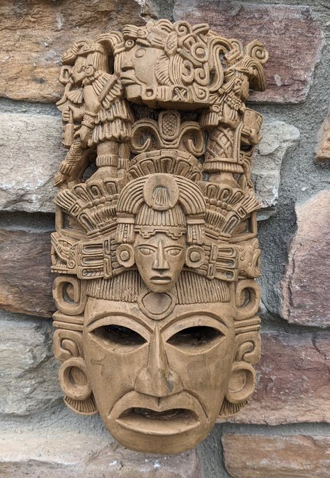 Aztec Mayan Yaxchilán mask wall plaque relief Sculpture  www.Neo-Mfg.com  carving We offer many custom color finishes like Silver Leaf, Bronze, Bronze with Patina, Aged stone, Pewter, Copper  All finishes are Faux finish, each piece of art is hand made and no two (2) pieces are the same. The color shown by camera and on the digital display may look different in real life. Lighting, surrounding colors, time of day, electronic display etc will change true life colors. www.NEO-MFG.com Faux finishes Mesoamerican Tattoo, Mayan Masks, Mayan Mask, Aztec Artwork, Mexican Artwork, Colombian Art, Ceramic Art Sculpture, Mayan Art, Mask Wall