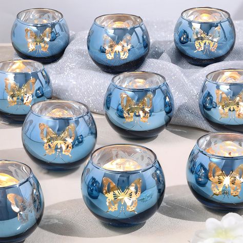 PRICES MAY VARY. ❤️Blue Votive Candle Holders: The blue candle holder is brightly colored and has a unique and elegant design. When lit, it projects a beautiful butterfly light, giving you a dreamy and enchanting atmosphere. You deserve it. ❤️Perfect Blue Candleholders Decoration：Use this blue candle holder at your wedding or dining table, with beautiful butterflies dancing, creating a romantic and unique atmosphere for you. It is especially suitable for summer seaside weddings and various celeb Purple Butterfly Centerpieces Quinceanera, Blue Butterfly Decorations For Party, Pink And Blue Quinceanera Decorations, Centerpieces Wedding Blue, Light Blue Centerpieces, Baby Blue Party Decorations, Butterfly Bridal Shower Ideas Decoration, Blue Sweet 16 Decorations, Blue Butterfly Quinceanera Theme