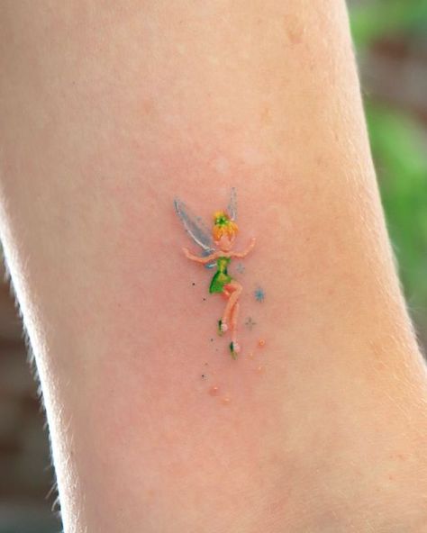 OVENLEE 🍃 ChaeheeLee on Instagram: "Teeny tiny tinkerbell ✨  #tinkerbelltattoo #tinkerbell #cutetattoo #minitattoo #tattoooftheday #smalltattoosforgirls #latattooartist" Tiny Disney Tattoo, Tinkerbell Tattoo, Tinker Bell Tattoo, Disney Inspired Tattoos, Unique Small Tattoo, Turtle Tattoo Designs, Bestie Tattoo, Ear Tattoo Ideas, Small Pretty Tattoos