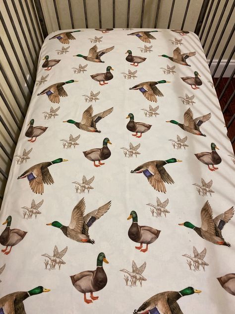 "Fitted Crib Sheet in a mallard duck cotton print. Sheets are made to order; current production time is approximately 3 weeks. Crib sheet fits standard size crib mattresses measuring approximately 28\" x 52\". 100% cotton fabric Machine Wash Cold - Gentle Cycle/Tumble Dry Low Visit our shop for additional bedding sets and accessories: https://www.etsy.com/shop/BabyBeddingbyJBD" Hunting Nursery, Duck Nursery, Baby Boy Crib Bedding, Crib Bedding Boy, Baby Nursery Inspiration, Baby Boy Cribs, Baby Room Themes, Boys Crib, Nursery Room Design