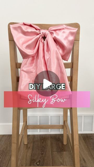 Christmas Wreaths Bows Diy, How To Make A Bow Using A Chair, Big Fabric Bows Diy, Extra Large Bow Diy, Large Satin Bow Diy, How To Make A Huge Bow, Giant Bow Diy Christmas, Giant Bow Tutorial, Tree Bow Topper Diy