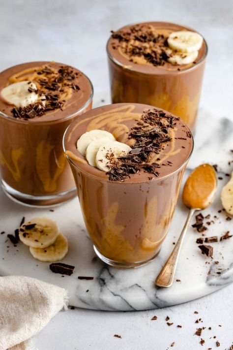 Deliciously creamy chocolate peanut butter banana smoothie that seriously tastes like a Wendy's frosty! This healthy chocolate banana smoothie recipe is made with just five ingredients and is easy to customize with your favorite nutritional boosters. The perfect breakfast, snack or even dessert! #smoothie #banana #peanutbutter #veganrecipe #veganbreakfast #dairyfree #healthybreakfast #healthysnack Chocolate Peanut Butter Banana Smoothie, Almond Breakfast, Wendy's Frosty, Healthy Chocolate Banana, Chocolate Banana Smoothie, Chocolate Peanut Butter Smoothie, Almond Smoothie, Peanut Butter Banana Smoothie, Keto Smoothie Recipes