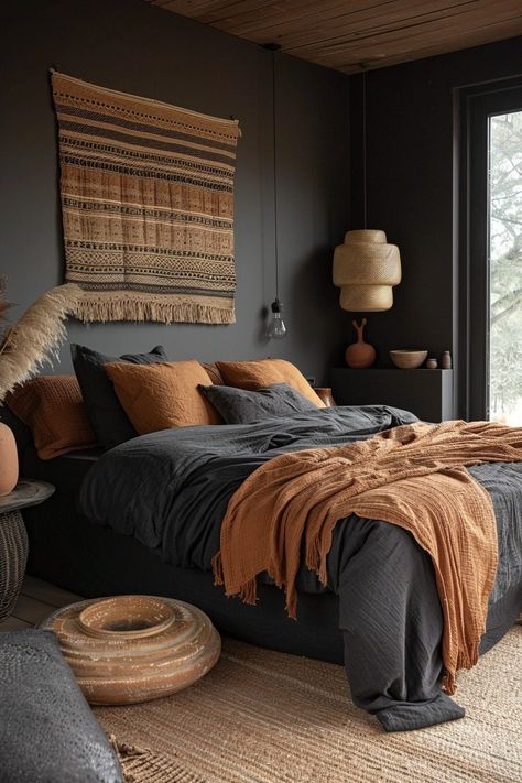 29 Black Bedroom Ideas for a Bold and Sophisticated Space 25 Southwestern Bedroom Decor Ideas, Bedroom With Rust Bedding, Industrial Black Bedroom, Bedroom Decor Terracotta, Terracotta Black Bedroom, Burnt Orange Color Palette Bedrooms, Maroon Boho Bedroom, Natural Decor Bedroom, Afrohemian Bedroom