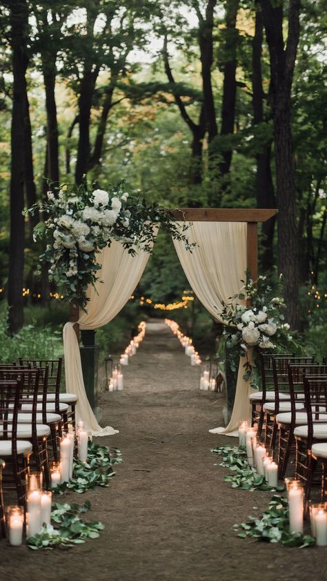 A wedding forest with dirtpatways, candlight line aisle, a wooden wedding arch with white drapes adn wedding flowers. The scene is from a fairytale story. Enchanted Forest Wedding Theme, Forest Fairytale, Forest Wedding Venue, Boho Wedding Theme, Forest Theme Wedding, Enchanted Forest Wedding, Wedding Aisle Decorations, Rustic Fall Decor, Aisle Decor