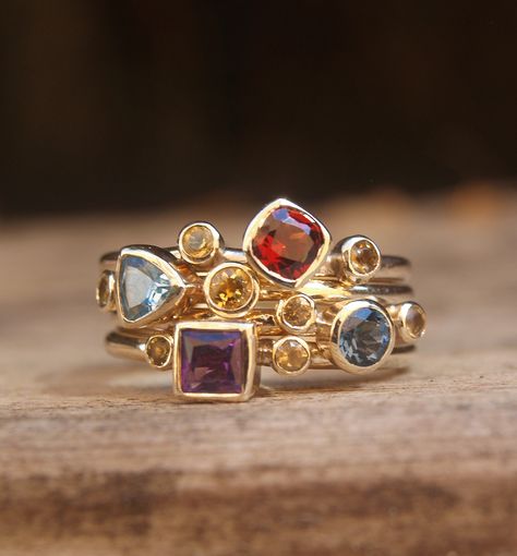 Multistone stacking set in recycled 9ct yellow gold. Multi Colour Gemstone Rings, Harlequin Engagement Ring, Colourful Gemstone Jewellery, Nine Gems Ring, 3 Gemstone Ring, Stacking Gemstone Rings, Multiple Gemstone Rings, Contemporary Ring Design, Multi Stone Rings Unique