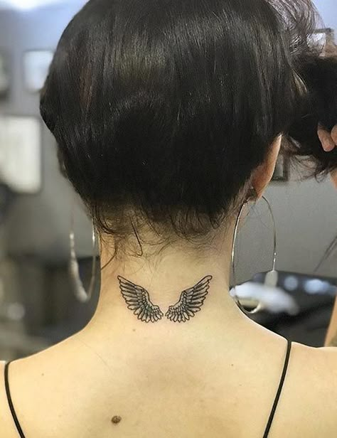 21 Angel Tattoo Designs That Will Inspire Your Next Tattoo Outing Behind The Neck Tattoos, Wing Neck Tattoo, Small Angel Tattoo, Angel Tattoo For Women, Alas Tattoo, Nape Tattoo, Wörter Tattoos, Band Tattoos, Neck Tattoos Women