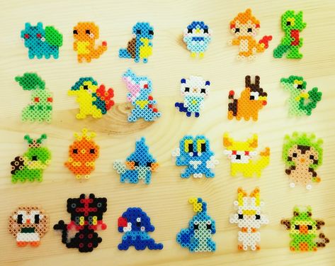 Hand made tiny perler pokemon charms Chikorita Perler Beads, Perler Beads Pokemon Small, Perler Beads Charms, Pokemon Bead Art, Tiny Hama Bead Designs, Small Pokemon Perler Bead Patterns, Pixel Perler Beads, Peeler Bead Pokémon, Pokemon Aquabeads