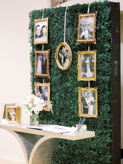 Gold-framed, black and white photos make up this couple's family tree on a wall of green. Guests can sign and leave notes for the newlyweds below in the guestbook. Wedding by Bello & Blue Events. Green And Gold Wedding Ceremony, Emerald Green Black Gold Wedding, Emerald Green Gold And White Wedding Decorations, Emerald Gold White Wedding, Emerald And Gold Party Decor, Emerald Anniversary Party Ideas, Emerald And Gold Wedding Decor, Emerald Wedding Decorations, Dark Green And Gold Wedding Theme