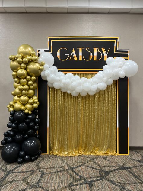 Balloon arch Gatsby styled on a coroplast wrapped column with coroplast printed topper. Prom Themes Great Gatsby, Roaring 20s 50th Birthday Party, Great Gasps Party Theme, 1920s Photo Backdrop, 1920s Decorations Roaring 20s, Banquet Theme Ideas Formal, Great Gatsby Decorations Ideas, Roaring 20s Party Decorations Diy 1920s, 1920s Backdrop