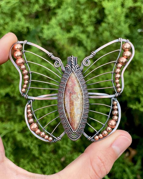 This is my third butterfly pendant, & I feel like each one has come out better than the last! 🤩🦋✨ This piece was made with a fossilized coral cabochon that has beautiful orange & pink hues. I wrapped it in oxidized copper wire, & added some copper beads for flair! It will be available in this week’s shop update. 🥰 • • • #butterfly #butterflypendant #butterflyjewelry #wirewrappedpendant #wirewrappedjewelry #wireweaving #wirewraping #wirewrap #handmadejewelry #jewelrymaking #fossilizedcoral Wire Jewerly, Fossilized Coral, Oxidized Copper, Butterfly Jewelry, Wire Weaving, Wire Crafts, Butterfly Pendant, Wire Wrapped Pendant, Jewelry Tutorials