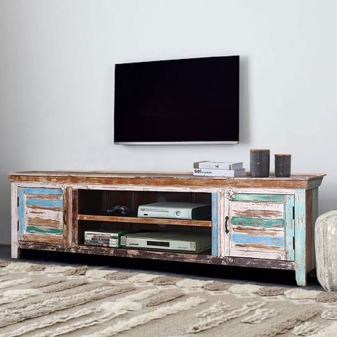 The unfettered grace and style of distressed furniture has reached a new peak, and now you can keep up with the styles by picking our Praze Distressed Reclaimed Wood TV Stand. With its simple and classy design, the distressed wood finish gets a chance to truly shine. The solid reclaimed wood is a sustainable and eco-friendly choice. Handcrafted by the most skilled artisans, you’ll definitely appreciate its durability, resilience, and heirloom quality. The smooth top is perfect for featuring LCDs Reclaimed Wood Tv Stand, Tv Entertainment Center, Media Consoles, Wood Tv Stand, Solid Wood Tv Stand, Reclaimed Wood Coffee Table, Wood Tv, Tv Stand Wood, Media Cabinet