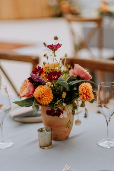 Summer Floral Wedding Centrepiece with pops of orange and pinks in terracotta pots Glasshouse Wedding, Summer Floral Wedding, Glass House Wedding, Orange And Pink Wedding, Summer Flower Arrangements, Wedding Centrepiece, Bright Wedding Flowers, Fiesta Wedding, Event Centerpiece