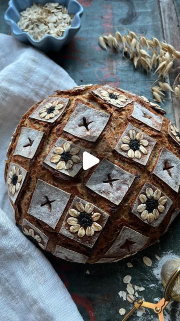 Judith | Sourdough & Bread on Instagram: "🌼 edible flowers 🌼  Had so much fun decorating this sourdough bread yesterday. I’ve always wanted to use oat flakes to decorate my bread just like @huangshiyun44 did before many many times. This beautiful method needs extra time but it turned out so beautiful. Check out Shiyun’s creations, there is so much inspiration on her page!   Flour + a little bit of water works like glue - none of the seeds fell off. The black seeds is black sesame by the way.   #sourdough #bread #seeds #oats #sourdoughstarter #brot #healthy #veganfood" Bread With Flowers, Decorate Bread, Sourdough Scoring, Bread Scoring, Homemade Sourdough Bread, Homemade Sourdough, Bread Art, Sour Dough, Brunch Time