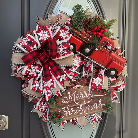 🚚 Searching for a Red Truck wreath with a twist? Consider one adorned with a 'Merry Christmas' or 'Comfy Cozy' sign for that special touch. This distinctive wreath could be the perfect find for you. Take a glance at the truck's bed, brimming with lush greenery, vibrant berries, and rustic pinecones. Notice how the sign is tastefully accented with greenery and berries at each corner. 🚚 The wreath is crafted on a 24-inch raised work form, encircled by 21-inch rustic deco mesh at the frame's base Truck Wreath Ideas, Red Truck Wreath, Red Truck Decor, Truck Wreath, Truck Decor, White Christmas Wreath, Candy Wreath, Christmas Gift Items, Red Truck Christmas