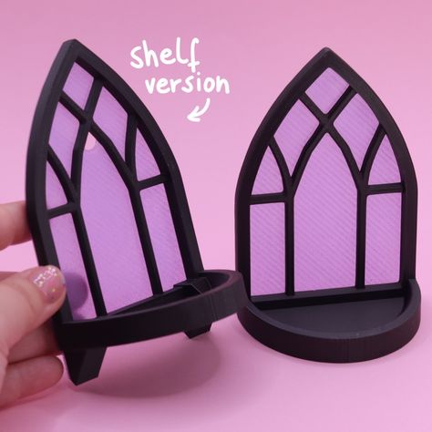 Another cute Halloween-themed addition to our shop! These bat and skeleton flexis are adorable on their own, but you can also get them with a decorative gothic window style stand or wall shelf! We looove this design by @layersingreen 💜 #halloweendecor #3dprinted #layersingreen Gothic Window, Gothic Windows, 2024 Planner, Window Styles, Wall Shelf, Cute Halloween, Halloween Themes, 3d Print, Wall Shelves