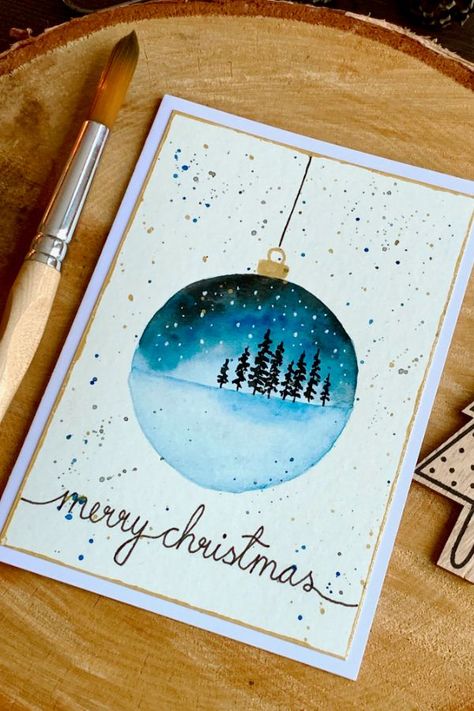 Beginner watercolour painting tutorial. Learn how to paint a very simple Christmas ornament decoration with a landscape. Here I have for you two cards, one with a snowy night sky and tries and the other with mountains during sunset. ----- #WatercolourLandscapeChristmasOrnament #HandmadeChristmasCards #ChristmasCardIdeas Snowy Night Sky, Beginner Watercolour, Watercolor Christmas Cards Diy, Landscape Christmas, Watercolor Holiday Cards, Snowy Night, Christmas Cups, Christmas Card Ornaments, Simple Christmas Cards