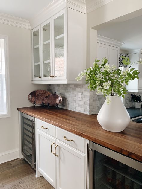 Custom walnut countertop to enhance this bar scene. Monogram applianced wine and beverage fridge for storage. Walnut Countertops Kitchen, Dry Bar With Butcher Block Top, Dry Bar Butcher Block Counter, Butcher Block Wet Bar, Butcher Block Countertops Dry Bar, Butcher Block Wine Fridge, Walnut Countertop Kitchen, Apron Front Kitchen Sink With Bucher Block, Karlby Walnut Countertop