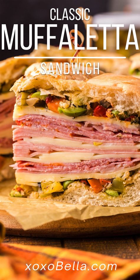 A well-made muffaletta sandwich with olive spread, deli meats and cheese is one of life’s culinary delights! It’s easy to make a muffaletta recipe yourself at home and it’s hard to beat this classic New Orleans sandwich. This show-stopping sandwich is guaranteed to satisfy even the heartiest appetite. Traditional muffaletta is the perfect combination of tasty ingredients. Boasting homemade olive spread along with delicious Italian deli meats and cheese, this is the ultimate sandwich. Muffaletta Recipe, Muffuletta Recipe, Muffaletta Sandwich, Ultimate Sandwich, Muffuletta Sandwich, Tailgate Recipes, Olive Spread, Slow Cooker Italian Beef, Sandwhich Recipes