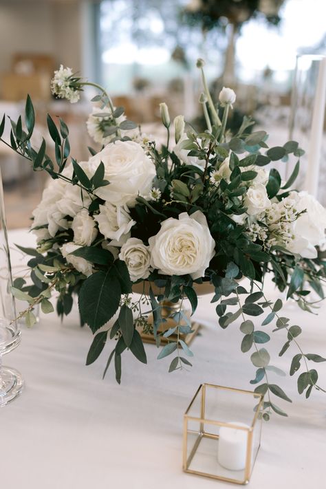 White Roses With Eucalyptus Centerpieces, Green And White Roses Wedding, Green And White Roses Centerpieces, Wedding Florals Greenery And White, Greenery And Flowers Centerpiece, Wedding Reception Flower Centerpieces, Classy Wedding Floral Arrangements, White Bouquet Centerpiece, White Green Wedding Flowers Centerpieces