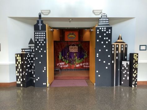 Superhero Office Theme, Superhero Christmas Decorations, Vbs Superhero Theme Decorations, Gotham City Themed Party, Superhero Hallway Decorations, Superhero Stage Design, Super Hero Vbs Decorations, Hero Hotline Vbs Decorations, Diy Superhero Decor