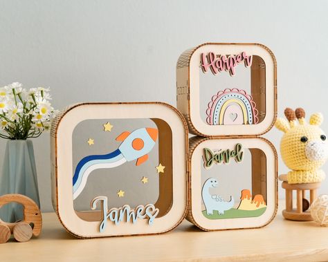 Welcome to our adorable Custom Baby Piggy Bank! Delight your little ones with this personalized wooden coin box. A perfect toddler gift, this letter piggy bank adds a touch of charm to nursery decor. Personalized name included for a special touch! For Safety, we will delivery your piggy bank with flat package and you can easily assemble it. This is instruction for piggy bank: https://youtube.com/shorts/LHsv2sJkJU8 These Piggy Bank are 100% handmade with High Quality Plywood and Arcylic DETAIL: - 1st Birthday Gift Basket, Fibrofacil Ideas, Piggy Bank Ideas, Kids Money Box, Baby Piggy, Custom Piggy Bank, Wooden Piggy Bank, Montessori Room, Wooden Money Boxes