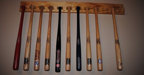 I built this for my son to display his collection of mini bats.  It took a couple of hours over two evenings to put together.  It's built fr... Bat Storage, Baseball Bat Holder, Baseball Bat Rack, Baseball Score Keeping, Baseball Bat Display, Sports Display, Bat Display, 4h Projects, Sports Crafts