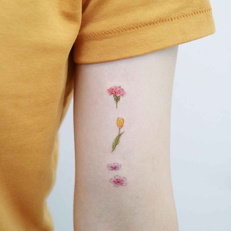 Tattoo artist Heemee, color lightness minimalistic tattoo | Seoul, Korea | #inkpplcom #lighttattoo #minimalistic #minimalistictattoo #minimalisticart #jewelry #jewelrytattoo #minimalicticjewelry #minimalism Tattoos For Women Small Meaningful, Carnation Tattoo, Minimalistic Tattoos, Kpop Tattoos, Minimalistic Tattoo, Tulip Tattoo, Pink Tattoo, Amazing Tattoos, Sweet Tattoos