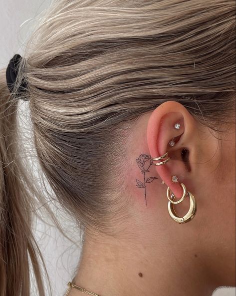 Small rose tattoo, behind the ear tattoos Fine Line Rose Tattoo Behind Ear, Small Red Rose Tattoo Behind Ear, Red Ink Rose Tattoo Behind Ear, Minimal Tattoo Behind Ear, Cute Tattoo Behind Ear, Dainty Rose Tattoo Behind Ear, Tattoo Ideas Ear Small, Behind The Tattoos Ear, Behind Ear Fine Line Tattoo