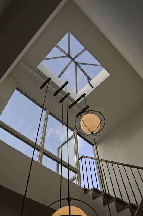 Skylight and wall of glass to bring natural light to lower floors Skylight Stairs, Wall Of Glass, Floating Ceiling, Interior Kitchen Small, Skylight Design, Glass Stairs, House Construction Plan, Stair Lighting, Interior Stairs