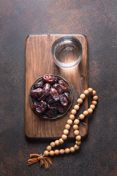 Ramadan. Dates in bowl, glass of water, wooden prayer beads on brown. Eid Mubara #Sponsored , #Sponsored, #AD, #bowl, #Ramadan, #Dates, #glass Ramadan Photography, Ramadan Dates, Islamic Photo, Arabic Dessert, Eid Food, Dark Nature, Ramadan Decoration, Dark Nature Aesthetic, Glass Of Water