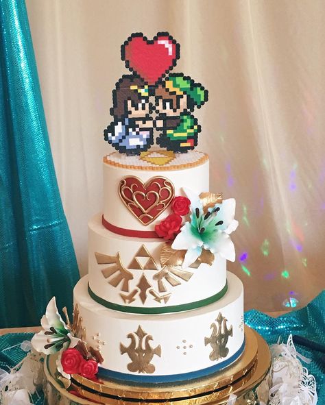 Zelda themed wedding cake? Yep we can do that! #zeldacake #nerdywedding Nerdy Cake Topper, Geeky Wedding Cake, Legend Of Zelda Wedding Cake, Video Game Wedding Cake, One Piece Wedding Cake, Nerdy Wedding Cake Toppers, Wedding Cake Gamer, Kingdom Hearts Wedding Cake, Legend Of Zelda Themed Wedding