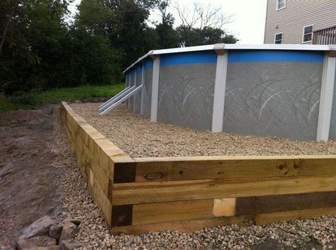 Retaining wall for above ground pool. Retaining Wall For Pool, Retaining Wall Around Above Ground Pool, Above Ground Pool Retaining Wall, Above Ground Pool Foundation, Diy Pools, Pool Retaining Wall, Rectangle Above Ground Pool, Pool Plans, Play Grounds