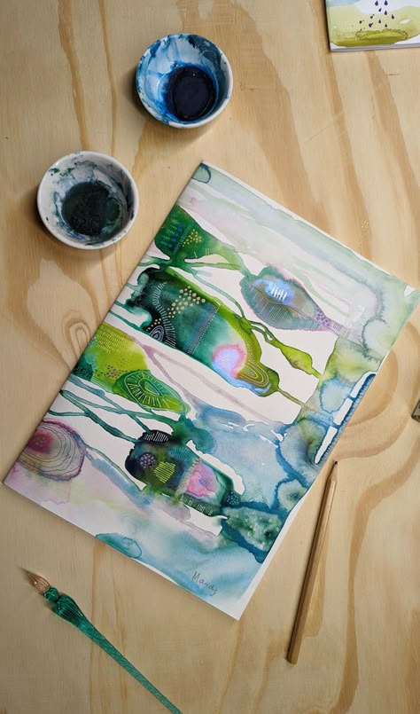 A brightly colored watercolour abstract on a table Trending Watercolor Art, Modern Watercolour Painting, Big Watercolour Painting, Abstract Watercolour Painting Ideas, Watercolour Abstract Art Inspiration, Black Watercolor Art, Watercolor Abstract Art For Beginners, 2023 Art Trends, Abstract Watercolour Painting