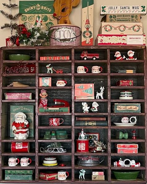 Brad, Mary & Harley on Instagram: "I love decorating this primitive cubby for all the holidays but … especially Christmas!! Hoping your Monday has been especially Merry!! 🎅🏻🦌🎄🎅🏻🦌🎄🎅🏻🦌🎄🎅🏻🦌🎄🎅🏻🦌🎄🎅🏻 . . . #santamugmonday #mugshotmonday #cubbydecor #vintageadvertising #blameitonmyvintageheart #perfectlyimperfectprims #howimonday #santaclaus #santaclausiscomingtotown #countrychristmas #vintagechristmas #hollyjolly #hohoho #hohohoitsavintagechristmas #merryvintagechristmas #santamu Vintage Cubbies, Cubby Decor, Vintage Cubby, Trinket Shelf, Knick Knack Shelf, Flea Market Decorating, Sleigh Bells, Printers Tray, Santa Claus Is Coming To Town