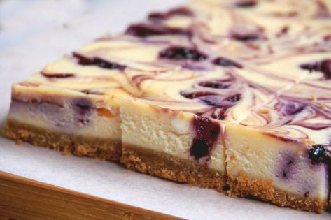 Blueberry Swirl Cheesecake Slice | The Annoyed Thyroid Blueberry Swirl Cheesecake, Cheesecake Slice, Blueberry Cheesecake Bars, Blueberry Cheesecake Recipe, Lemon Blueberry Cheesecake, Swirl Cheesecake, Afternoon Tea Recipes, Desserts With Biscuits, Coconut Desserts