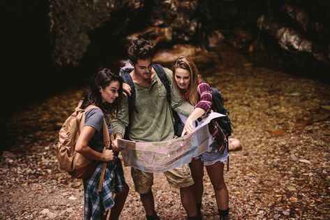 Man and two woman holding a navigation map while hiking. Tourists using a map to find the route to their destination. Holding Map Pose, Inktober 2024, Navigation Map, Drawing Base, Character Portraits, Ink Drawing, Pose Reference, Art Reference, Hiking