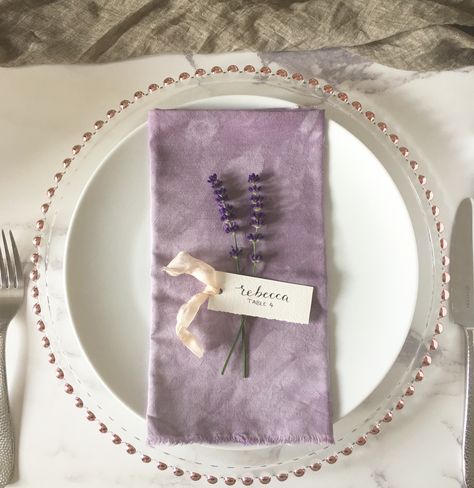 Luxury bohemian inspired purple lavender wedding table place setting. Featuring one of our hand deckled cotton rag name tags with hand written calligraphy and finished with a silk ribbon. Drop us a message or email for more information or to place an order Lavender Wedding Table, Purple Lavender Wedding, Wedding Tablescapes Round, Purple Table Settings, Wedding Table Lighting, Purple Wedding Tables, Wedding Table Place Settings, Luxury Bohemian, Purple Table