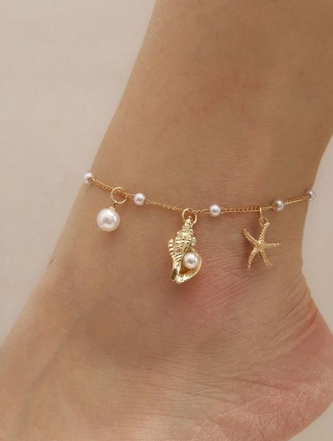 Dive into summer with our Ocean Breeze Anklet, a delicate piece that captures the enchanting beauty of the sea. This dainty gold anklet features a charming starfish, a tiny conch shell, and luminous pearls, evoking the serene vibes of a beach getaway. Lightweight and effortlessly chic, it's perfect for adding a touch of coquette elegance to your summer wardrobe. Embrace the ocean's magic with every step you take! Ocean Jewelry Aesthetic, Beach Jewelry Aesthetic, Gold Dainty Jewelry, Engagement Brunch, Life Gifts, Summer Wishlist, Anklet Gold, Surf Jewelry, Ocean Girl