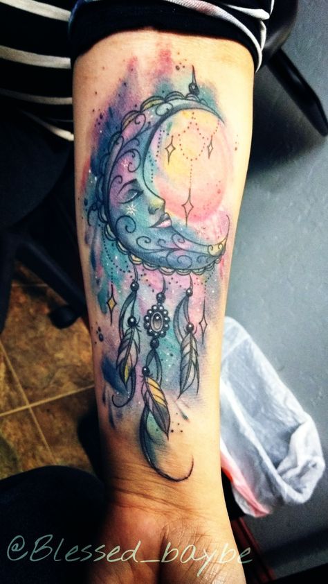 My tattoo is a dreamcatcher with universe in background. Symbolizes catching my dreams and letting the universe guiding and letting them happen. Tattoo by Bakon_one @RestlessValleyInk merced #Dreamcatcher #tattoo #universe #galaxy #feather #moon #sun #amazingtattoos #sleeve #watercolor #colorful #tattoos #moontattoo Watercolor Tattoo Background, Tattoo Plume, Moon Watercolor, Goth Lingerie, Dream Catcher Tattoo Design, Tattoos Infinity, Bestie Tattoo, Tattoo Watercolor, Tattoo Background