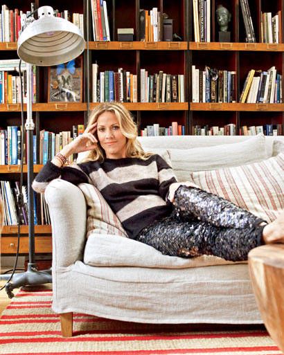 Sitting pretty: Crow in her NYC loft, with wall-to-wall draper's cabinets (used as bookshelves) from the Sundance catalog, a rug from Pottery Barn, and a table and couch from ABC Carpet & Home. (Crow wears sweater and pants by Isabel Marant; visit 	 	isabelmarant.tm.fr.) Catalog Furniture, Ny Loft, Nyc Loft, New York Loft, Sheryl Crow, Sundance Catalog, Vintage Americana, Celebrity Houses, Striped Rug