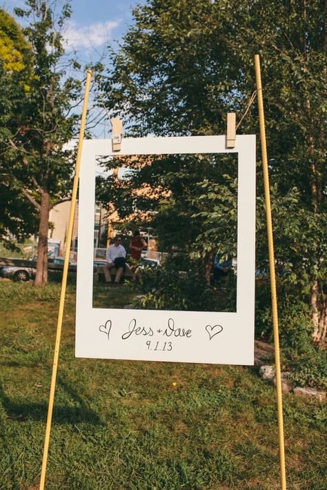 You can either set the two support poles in the ground, or put them in buckets filled with concrete (get a step-by-step in this how-to). Write your name and wedding date on the bottom of the photo frame, which you can make with poster board or foam board. Then, attach it to the poles with oversized clothespins, which you can find in most craft stores or online.Difficulty level: Jessica David, Diy Wedding Photo Booth, Hiasan Perkahwinan, Photo Booth Backdrop Wedding, Majlis Perkahwinan, Booth Backdrops, Boda Diy, Brewery Wedding, Rustic Wedding Decorations