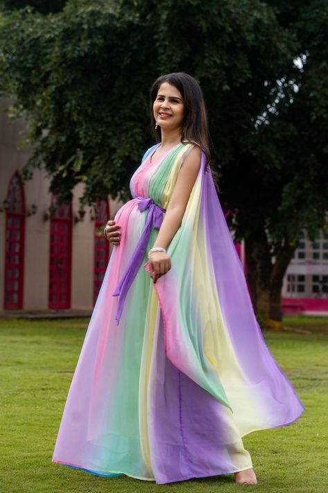 + OPTIONAL SLEEVES INSIDE 🍑 🤰🏻Multi colour long gown with detachable trail from shoulder. 🤰 cut sleve dress with attachable additional sleve 🤰Fits during and post-pregnancy Make your maternity shoot dreamy in our "Luxe Rainbow Trial maternity and baby shower dress ". Crafted in pastel colours with a trail and attachable sleeves as per your comfort. flowy Trail from shoulder adds fairytale look to your maternity photo-shoot. It is made in Georget fabric with cotton mul mul lining inside. Trail Photoshoot, Attachable Sleeves, Trail Dress, Baby Shower Dress, Shower Dress, Mom Wardrobe, Pregnancy Wardrobe, Baby Shower Dresses, Photoshoot Dress