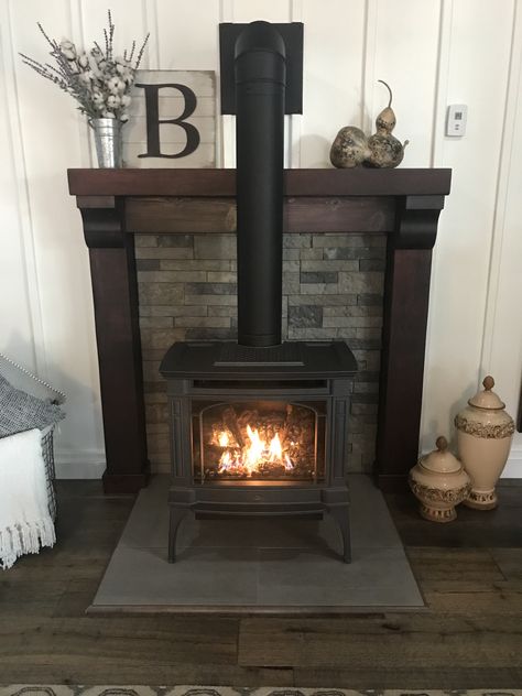 Mantel For Pellet Stove, Wood Stove In Family Room, Farmhouse Wood Stove Surround, Wall Behind Wood Burning Stove, Wood Stove Installation Wall, Decorating Around A Wood Stove, Pellet Stove With Stone Wall, Raised Wood Stove Hearth, Mantle With Wood Stove