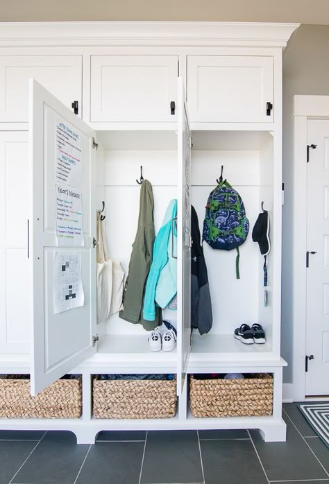 Blue and gray mudroom. Blue slate tile, white lockers and baskets in this lake house mudroom. Mudroom Blue, Lake House Mudroom, White Lockers, Blue Slate Tile, Gray Mudroom, Blue Mudroom, House Mudroom, Mudroom Remodel, Gray Painted Walls