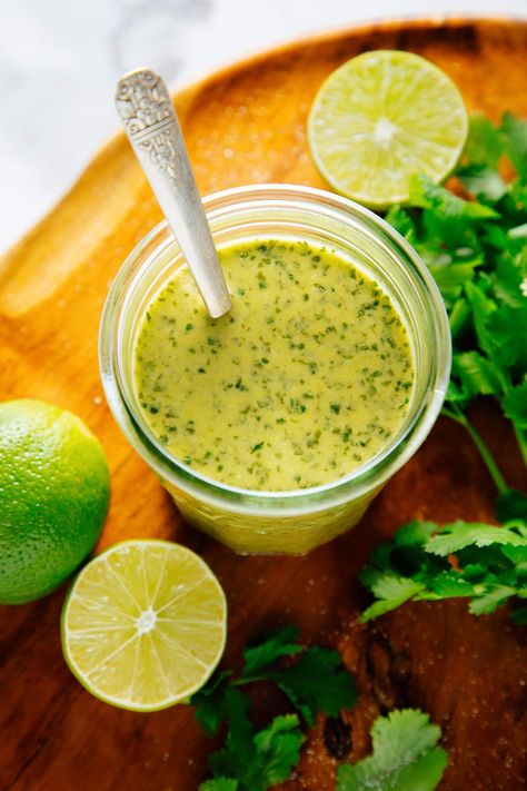 Make this cilantro lime dressing recipe for your next green salad! It's the perfect burst of freshness for your Mexican and Tex-Mex meals. Cilantro Salad Recipes, Cilantro Ginger Dressing, Cilantro Lime Dressing For Tacos, Cilantro Lime Dressing Vinaigrette, Mexican Ceasar Salad Dressing Chopt, Mexican Salad With Cilantro Lime Dressing, Greek Yogurt Cilantro Lime Dressing, Healthy Cilantro Lime Dressing, Mexican Salad Dressing